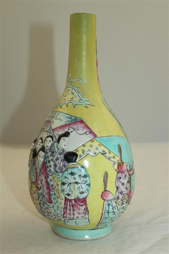 A Chinese moulded and enamelled biscuit porcelain bottle vase, Qianlong seal mark, 19th century, 22.5cm, neck restored